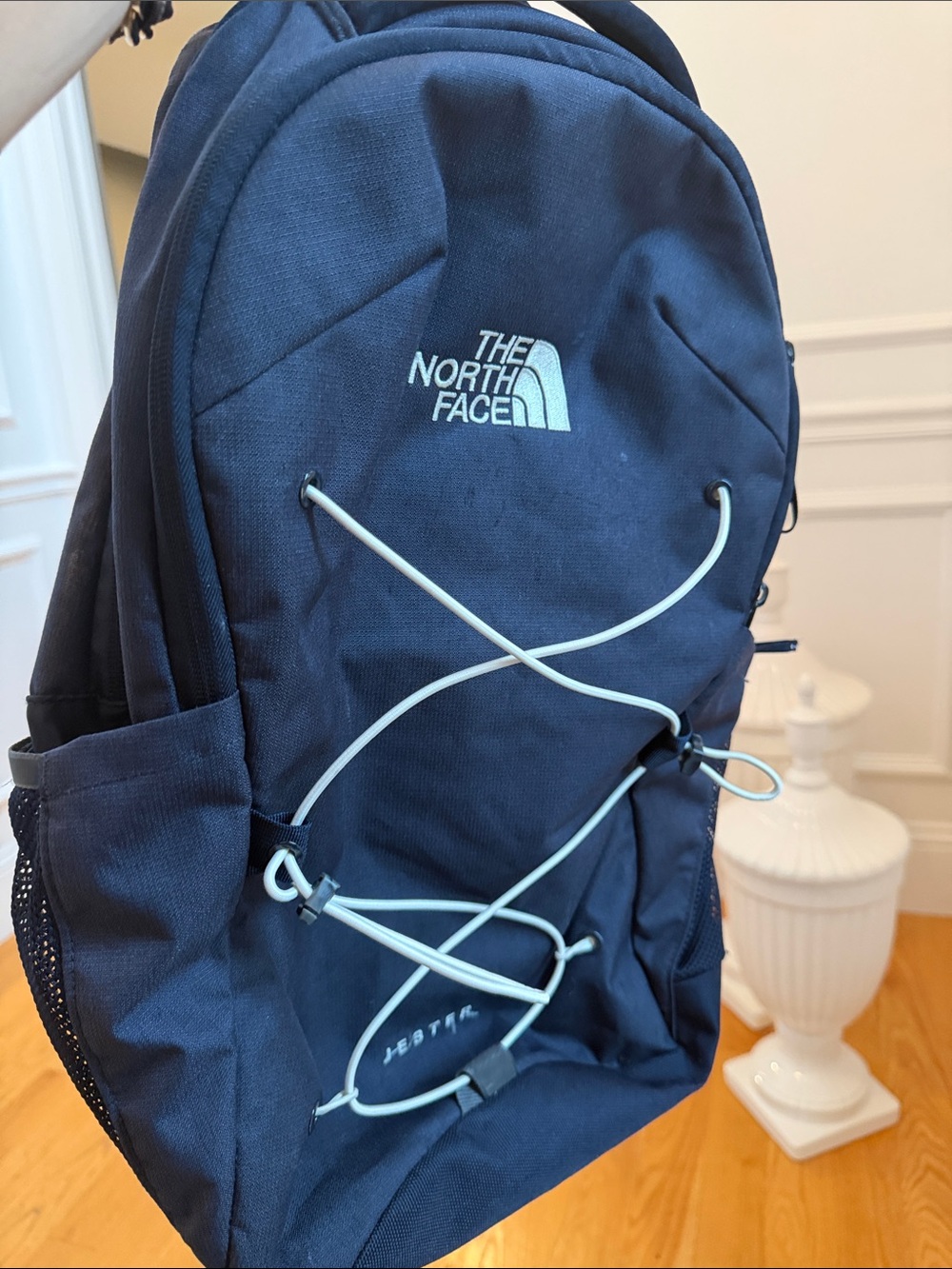 The North Face Navy Blue Backpack with White Bungee Cord